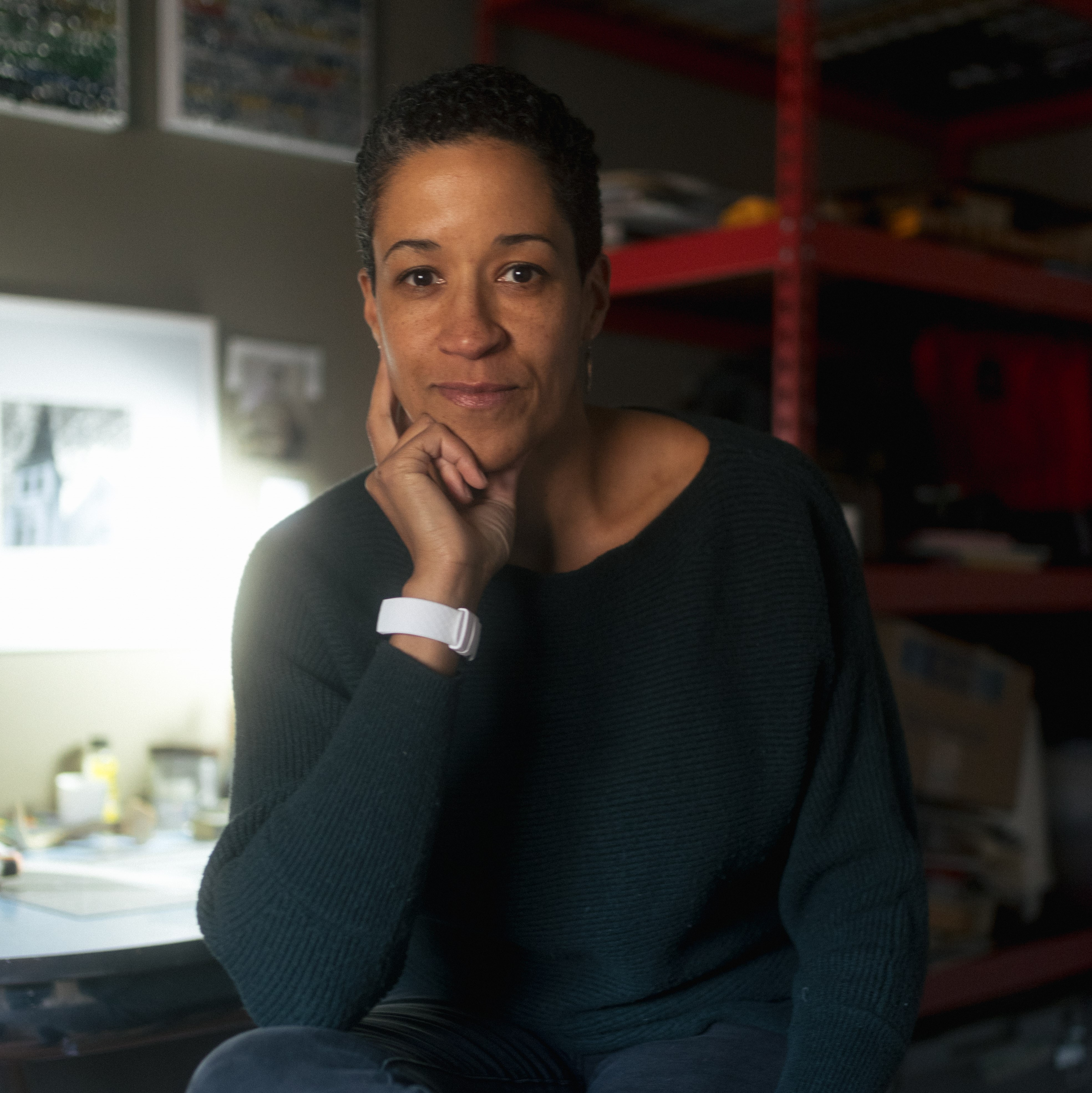 artist Christina Hunt Wood sitting in her studio